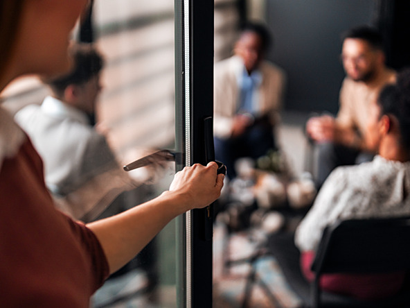 Person walking into meeting room